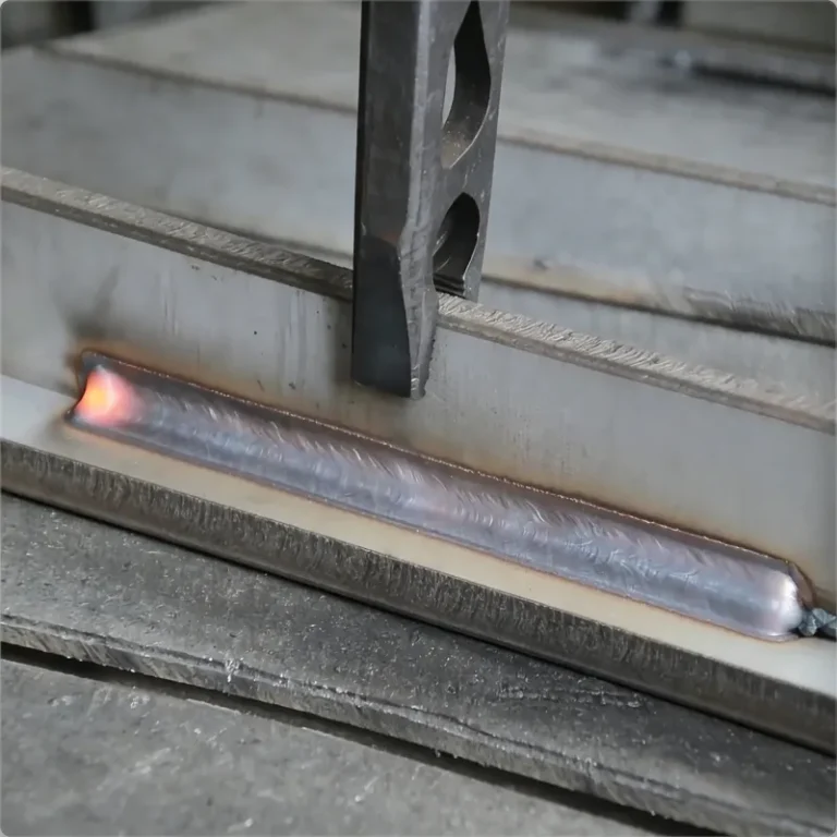 Fresh fillet weld bead on a T-joint with clean plate on both sides