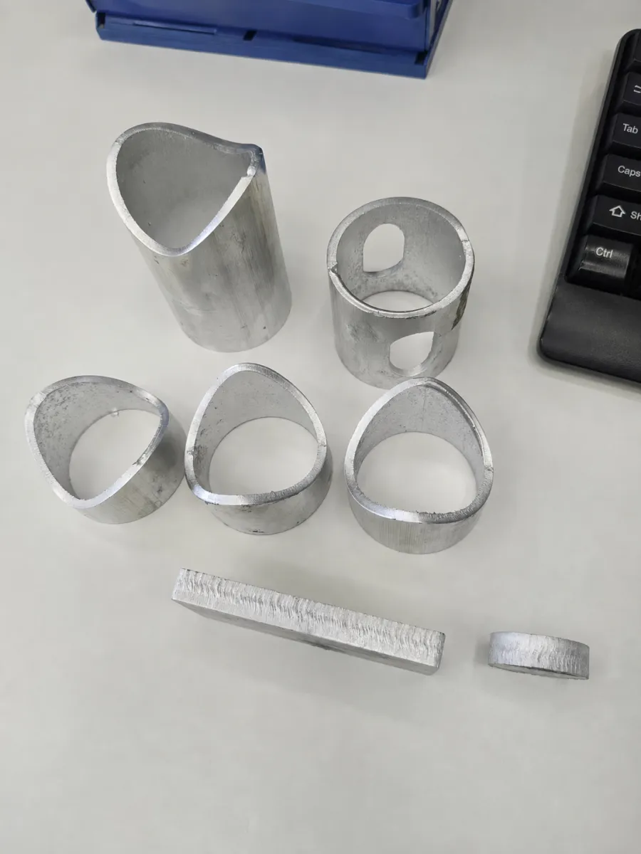 Laser-cut part from a tube and sheet laser cutting machine